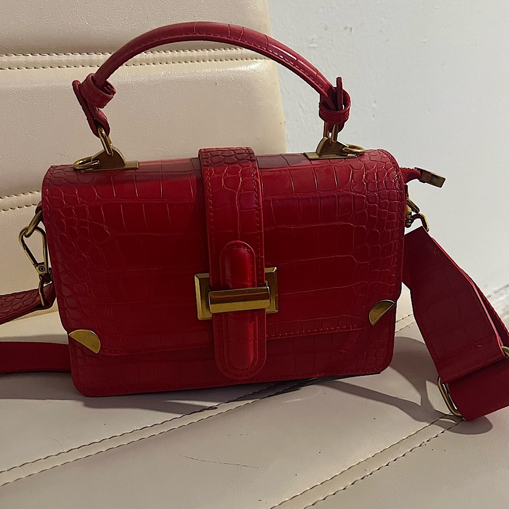 leather red purse with gold accents